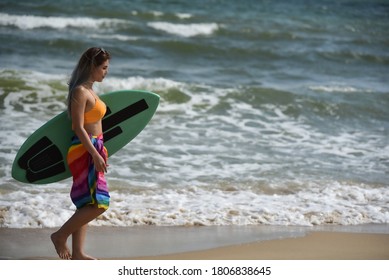 Sexy Beautiful Asian Surfer Woman In Bikini Swimwear With Surfboard On The Beach/Extreme Sport On Summer Holiday Vacation