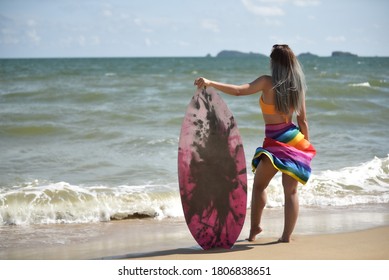 Sexy Beautiful Asian Surfer Woman In Bikini Swimwear With Surfboard On The Beach/Extreme Sport On Summer Holiday Vacation