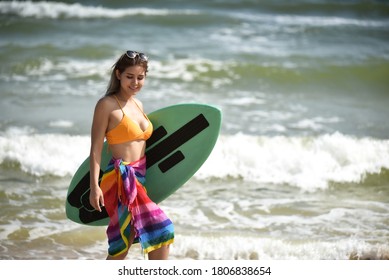 Sexy Beautiful Asian Surfer Woman In Bikini Swimwear With Surfboard On The Beach/Extreme Sport On Summer Holiday Vacation