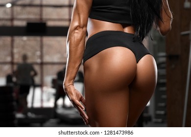 Sexy beautiful butt in thong, sexy ass. Fitness woman in gym