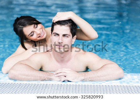 Sexy Beautiful Couple In Love Relaxing In The Water Of A Swimming Pool Sexy Beautiful Couple In Love Relaxing In The Water Of A Swimming Pool