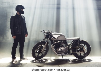 Sexy Biker Man Wearing Jeans And Leather Jacket Standing With Motorcycle. Urban Scene