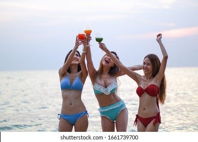 sexy bikini party seaside enjoy meeting group friends having fun dancing and drinking beverage on the beach, happy life on summer season