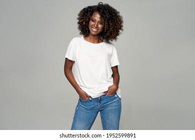 Sexy black woman with afro hair wear classic outfit isolated on gray background