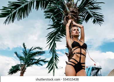 Sexy Blonde Girl On The Beach With Palms And Blue Sky