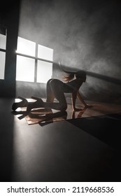 Sexy Blonde In Harness On A Black Cyclorama