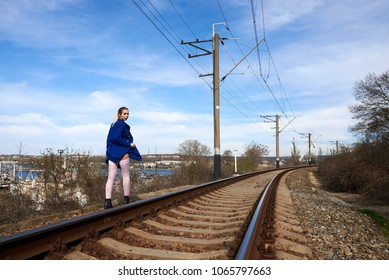 Sexy blonde in lingerie and stockings walking on the railways - Shutterstock ID 1065797663