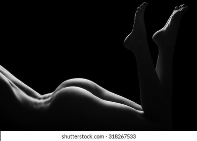 Sexy body nude woman buttocks. Naked sensual beautiful back. Black and white photo.