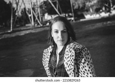 Sexy Brunette Woman In Fashionable Vintage Cheetah Print Coat Posing At Golden Hour In Sunlight In Los Angeles