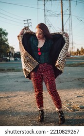 Sexy Brunette Woman In Fashionable Vintage Cheetah Print Coat Posing At Golden Hour In Sunlight In Los Angeles