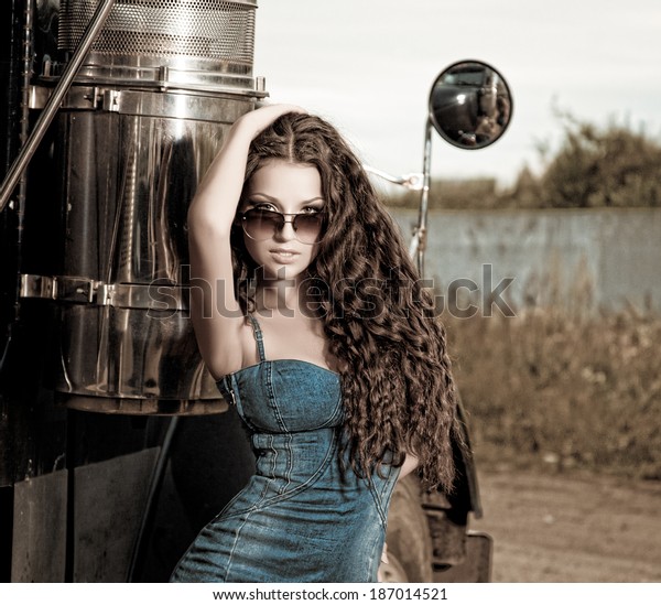 Sexy brunette woman and\
truck