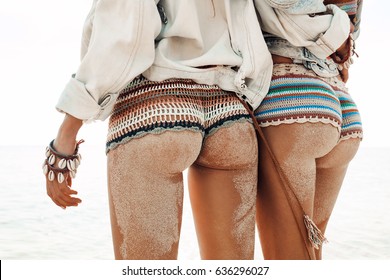 sexy buttocks in bikini on sea background