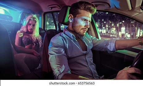 Sexy Couple In An Elegant Car, At Night