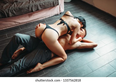 Sexy couple makes love on the floor, erotica