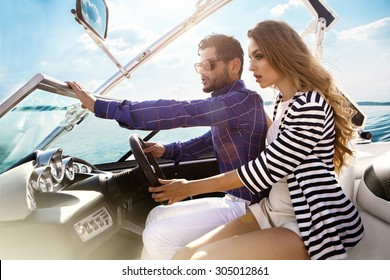 Sexy couple on the luxury yacht