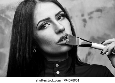 Sexy Cute Woman Face Or Pretty Girl With Brunette Long Hair And Lipstick On Lips Has Fashionable Makeup On Colorful Background, Holds Yellow Artist Brush