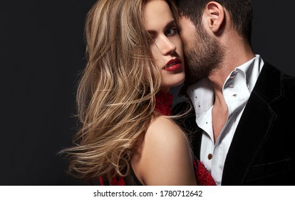 Sexy Elegant Couple In The Tender Passion. Beautiful Woman Near The Man.