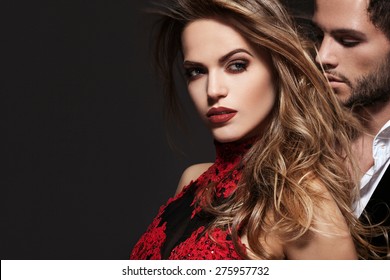 Sexy Elegant Couple In The Tender Passion. Beautiful Woman Near The Man.