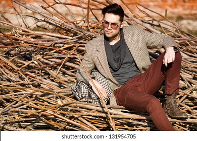 Sexy Fashion Man Model Dressed Elegant Holding A Bag Posing Outdoor