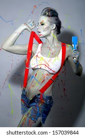 Sexy Female House Painter Splattered With Latex Paint