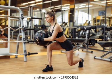 Sexy Fit Woman With Perfect Body Training With Medicine Ball In Gym. Functional Training 