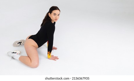 Sexy Girl In A Black Bodysuit And Sneakers Shows Booty Dance In The Studio