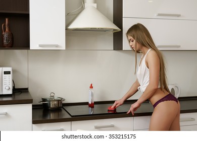 Sexy Girl In Lingerie Makes Cleaning Kitchen