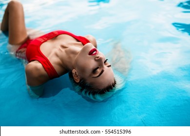 Sexy Girl With Long Blonde Hair And Red Lips In Swimming Pool