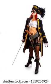 sexy girl in a pirate costume and a cocked hat stands armed with a sword on a white background in high heels. With a hook instead of the left hand