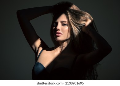 Sexy Gorgeous Woman With Shadows On Beautiful Face On Black Studio. Sensual Girl With Art Shadow Light.