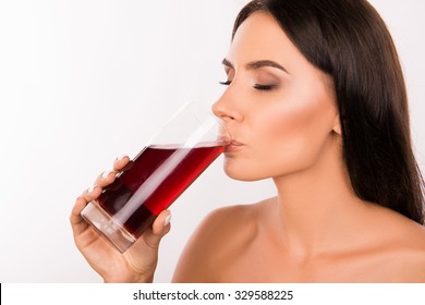 Sexy Healthy Young Woman Drinking  Cherry Juice