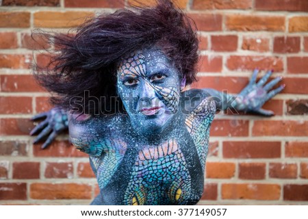Sexy Hot Model In Body Paint With Blue Face Sexy Hot Model In Body Paint With Blue Face