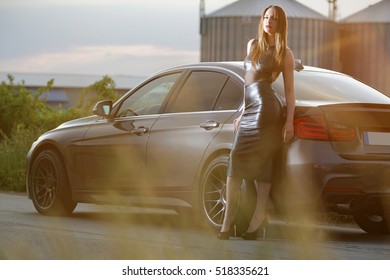 Sexy lady with a sport car