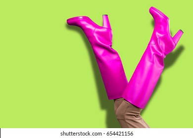 Sexy legs in pink high boots