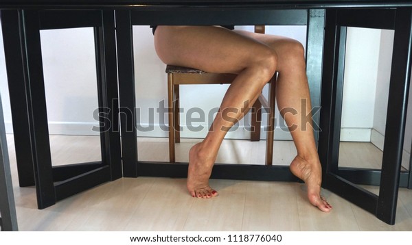 Her hot legs under the restaurant table