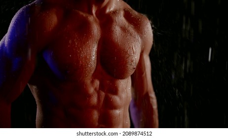 Sexy Male Torso In Rain Or Shower, Closeup View Of Tensed Muscles On Abdomen, Six Pack