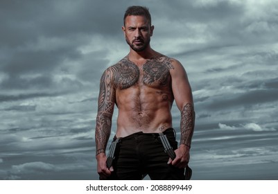 Sexy man with naked torso. Strong muscular male body, muscles guy. Confident attractive man with serious face.