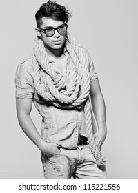 Sexy Man Wearing Glasses Doing A Fashion Photo Shoot In A Professional Studio