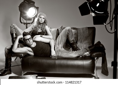 Sexy Man And Woman Doing A Fashion Photo Shoot In A Professional Studio