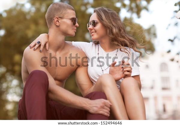 Sexy
man and woman doing a fashion photo shoot in 
sunset