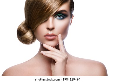 Sexy model in stylish image with sleek hair covering one eye and beautiful green eyeshadows on another against white background