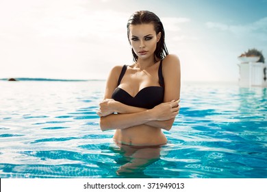 Sexy model wearing bikini in the pool
