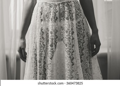 Sexy Model Wearing White See Through Dress, Closeup On Hips. Female Over Tulle Window Background