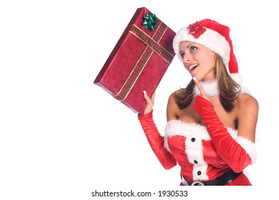 Sexy Ms. Santa Claus With A Christmas Gift In Her Hand