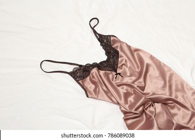 Sexy night dress lying down on the bed.