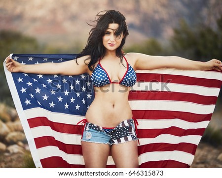 sexy-patriotic-woman-holding-american-450w-646315873.jpg