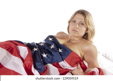 Sexy Pinup Calendar Girl Young Woman Implied Nude Wrapped American Flag Looking Into The Camera Seductively. Patriotic, For The Holidays Fourth Of July, Independence Day, Flag Day, Veterans Day