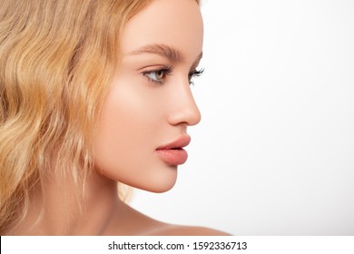 Sexy plump Lips Close-up. Lip Gloss. Beautiful  Perfect Makeup. Beautiful peach lips. Beauty. dental implants. mouth. profile.  Cosmetic  beauty procedures.  - image               