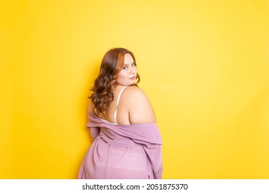 Sexy Plus Size Young Woman In Lingerie With Sensual Pose From Behind In Silk Robe