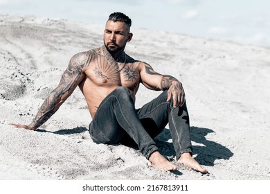 Sexy Portrait Of Muscular Handsome Topless Male Model At The Beach.